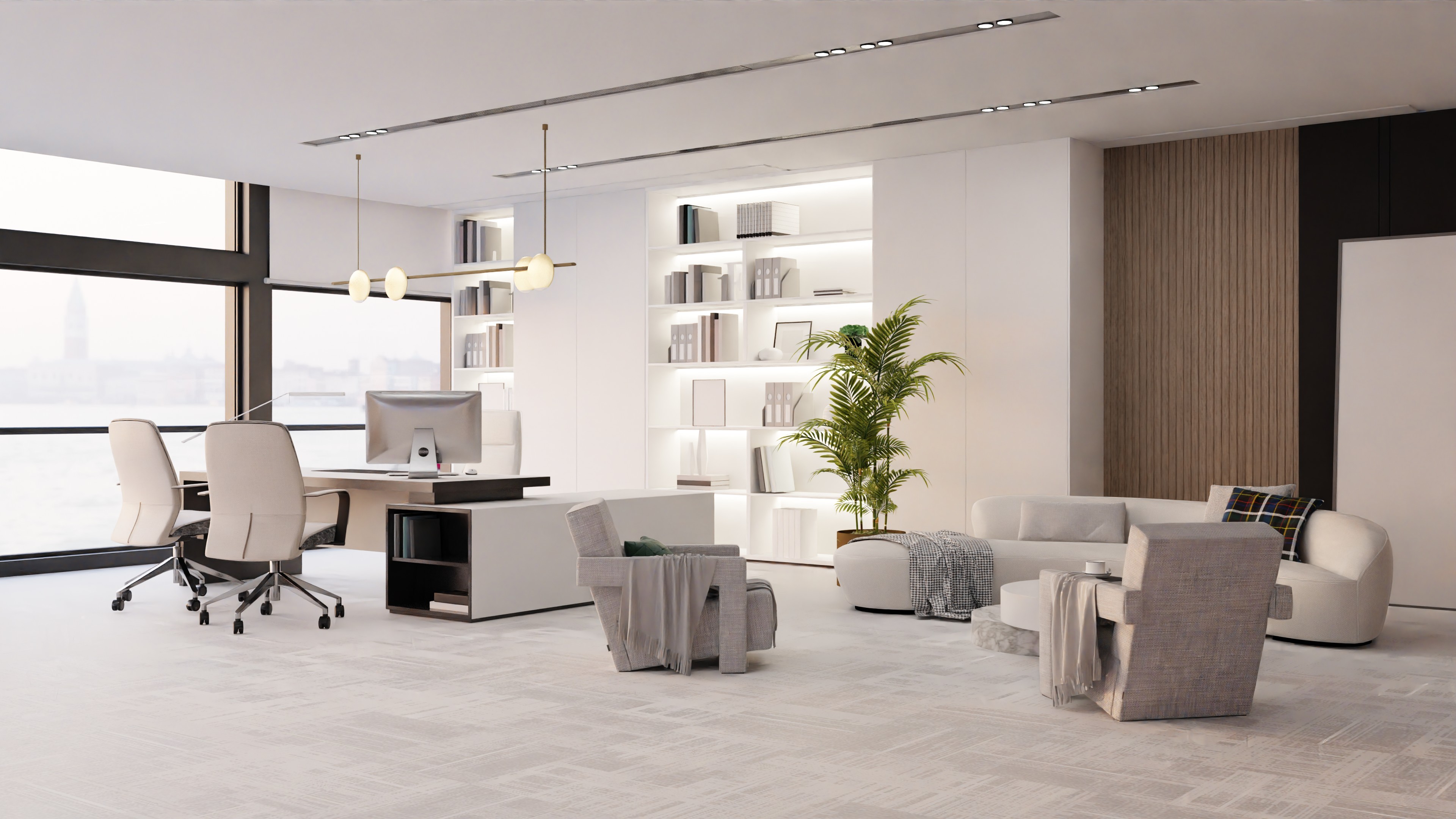 大きな窓から水辺の景色が見える、白とベージュを基調にした明るいオフィスラウンジ。デスクとオフィスチェア、観葉植物、背面の本棚、ソファとアームチェア、ローテーブルが配置され、落ち着いたモダンな雰囲気を演出している。